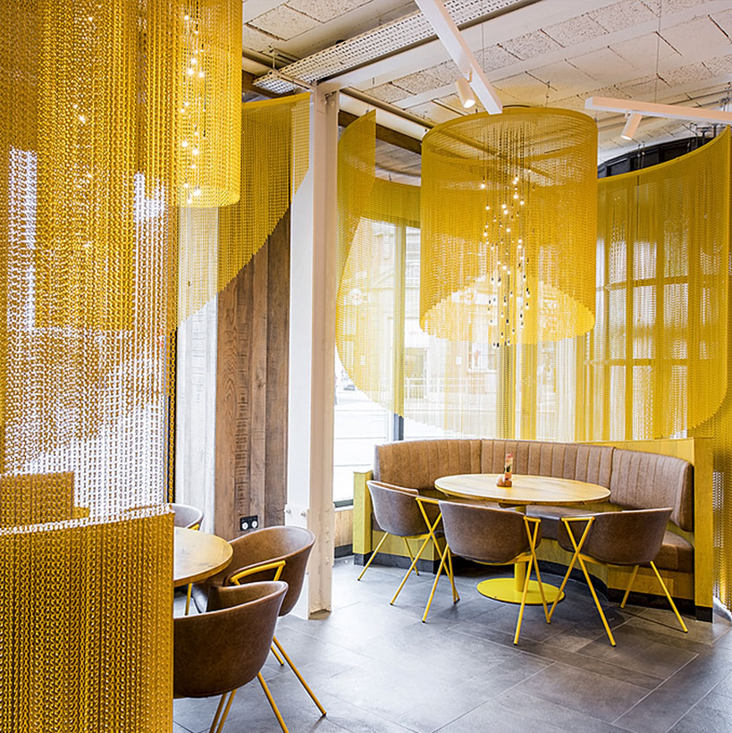 Metal coil drapery for hotel partition