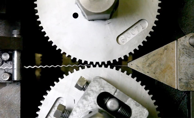 The machine is crimping the wire