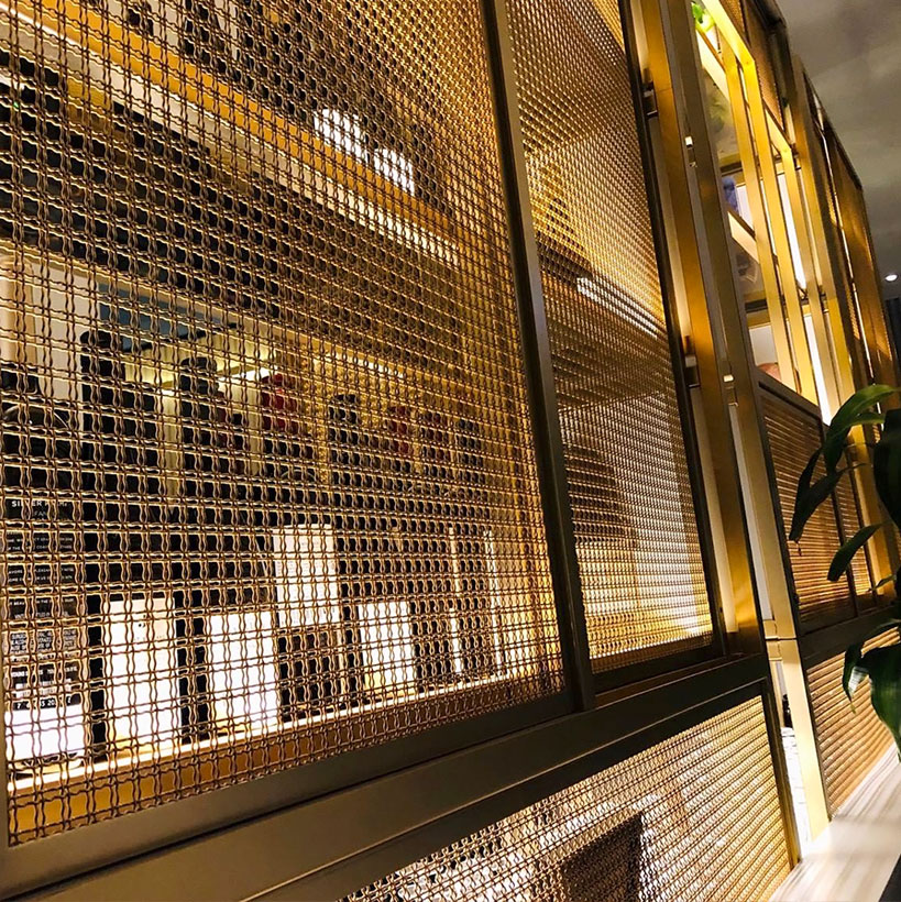 Architectural crimped mesh for shopping mall partition